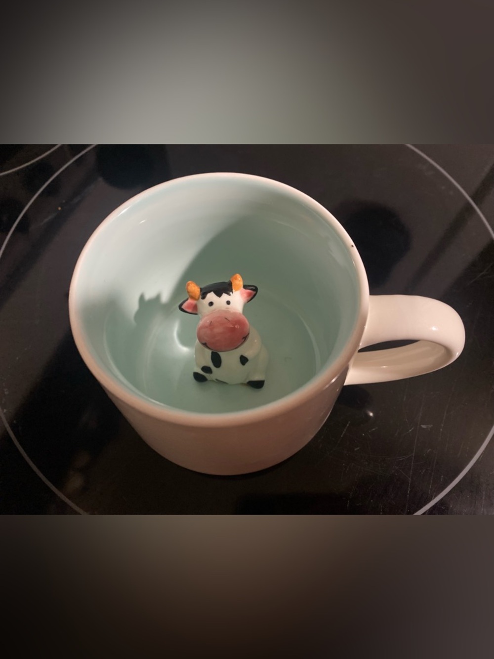Peek-a-boo ceramic cow mug